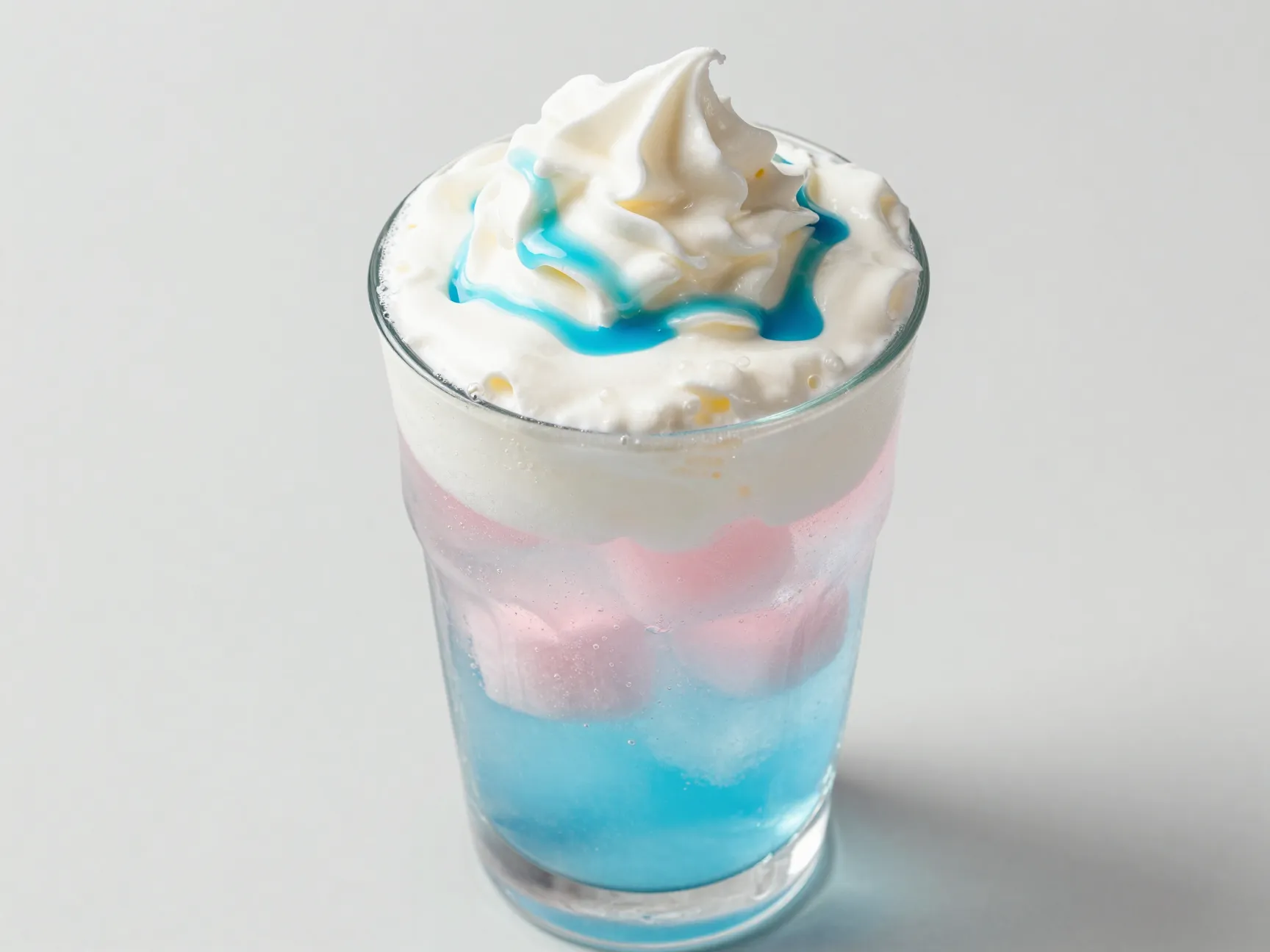 Cotton candy dirty soda with vanilla cream layered over ice