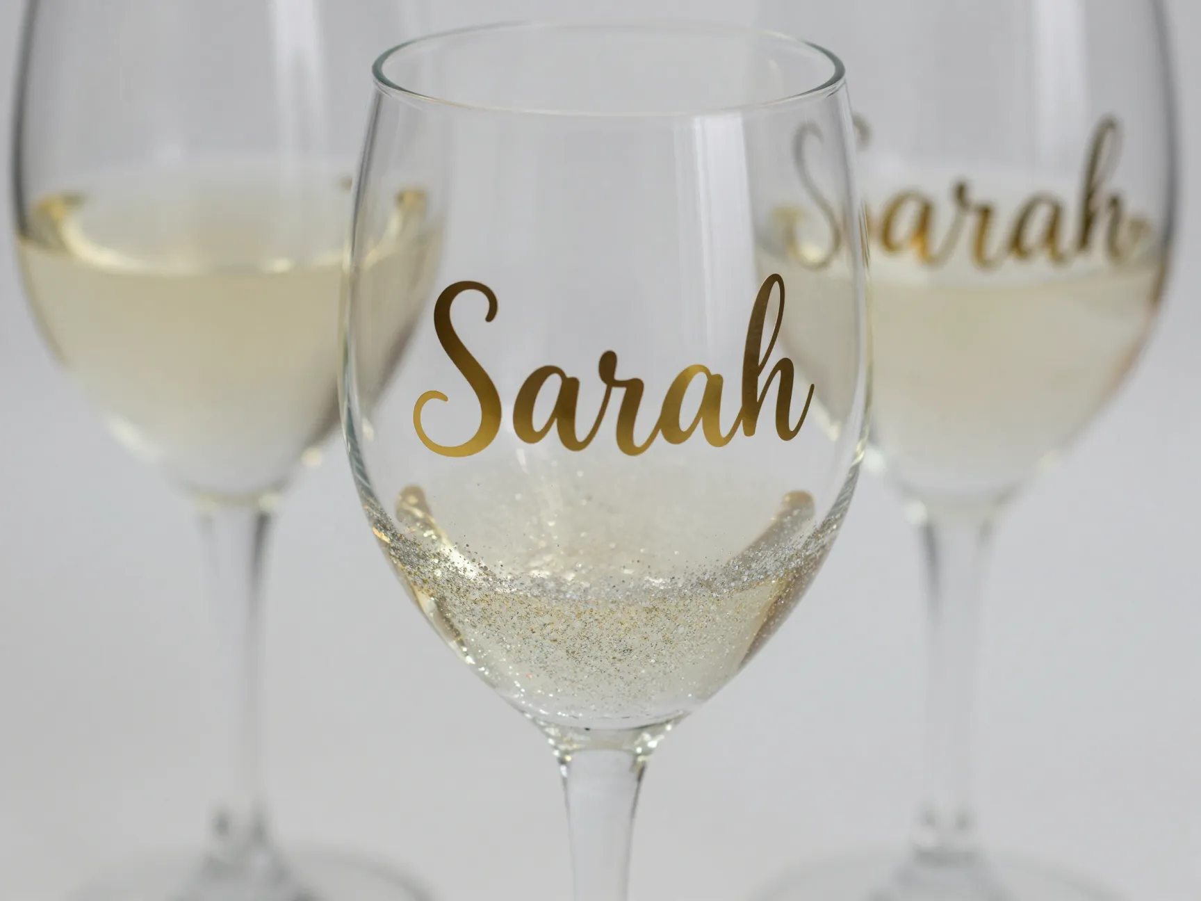 Personalized glitter wine glass with custom name for a bridesmaid gift