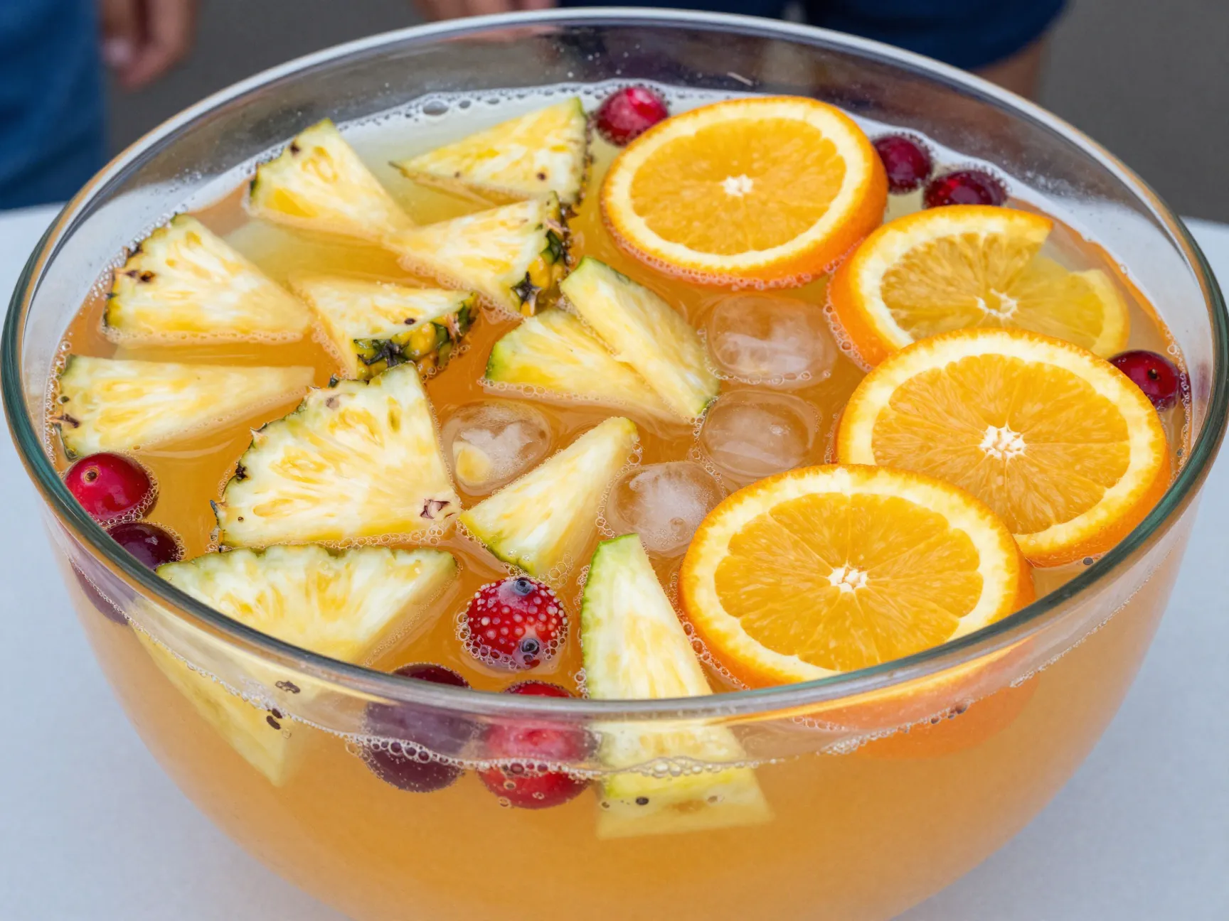 Non alcoholic jungle juice with pineapple orange and mixed berries