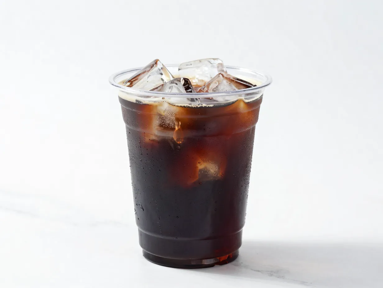 Cold brew in clear cup with ice cubes