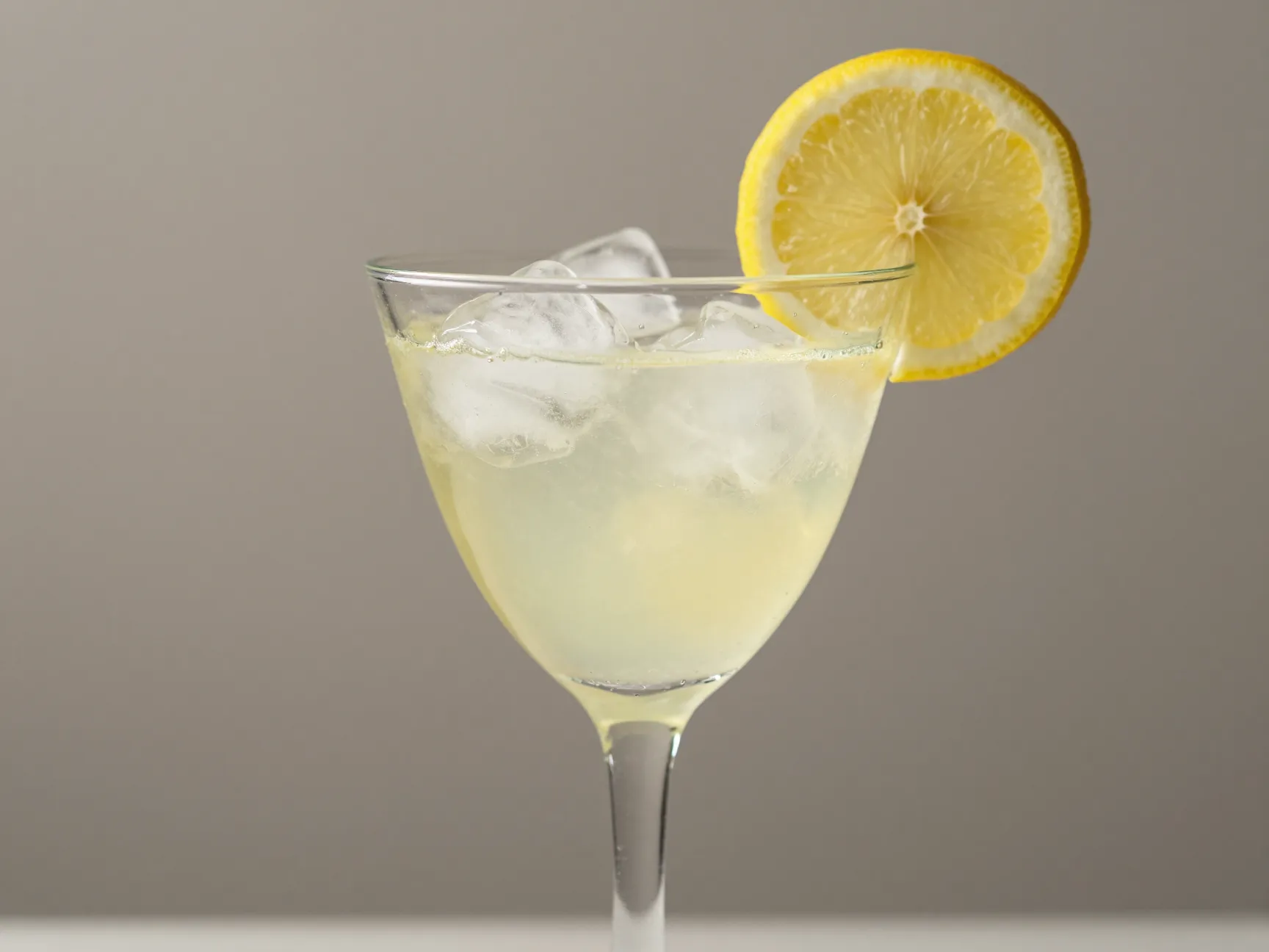 Flora wine glass ice non alcoholic martini floreale lemon slice