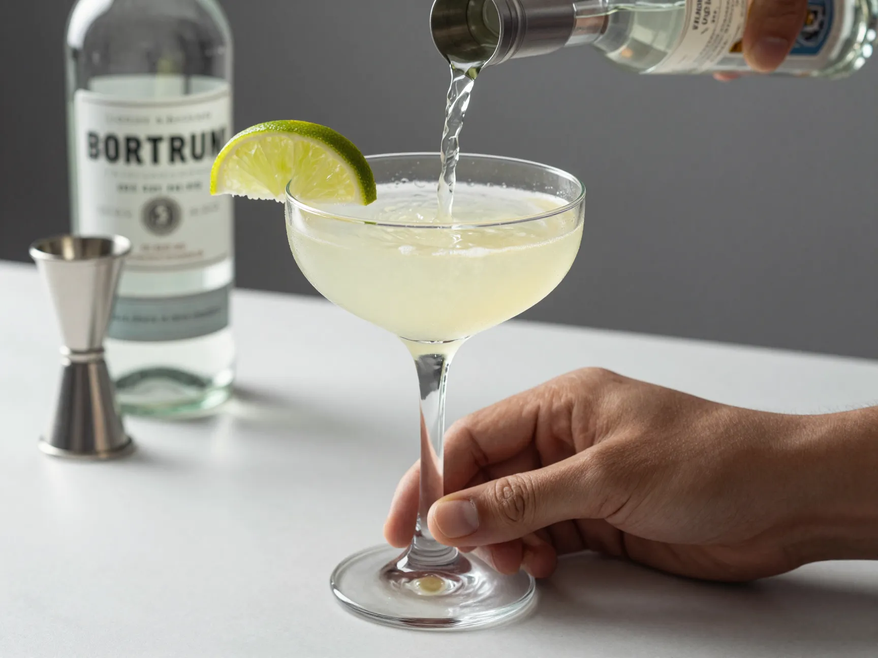 A shaken classic daiquiri in a chilled coupe glass