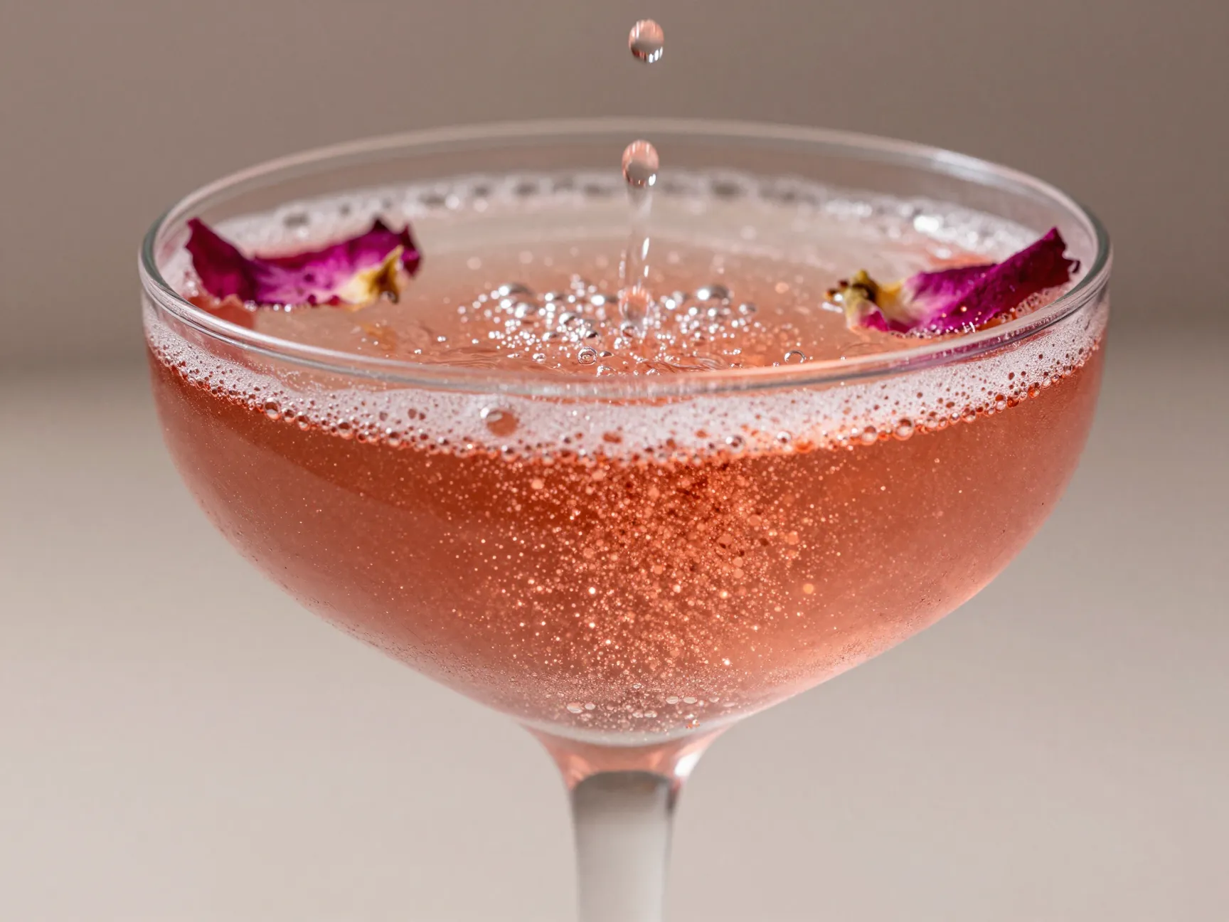 Shimmering rose gold cocktail luster dust champagne flute