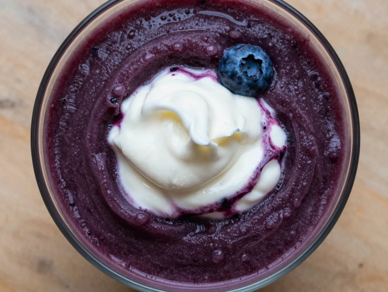 Blueberry lemon burst slushie deep purple with creamy swirl