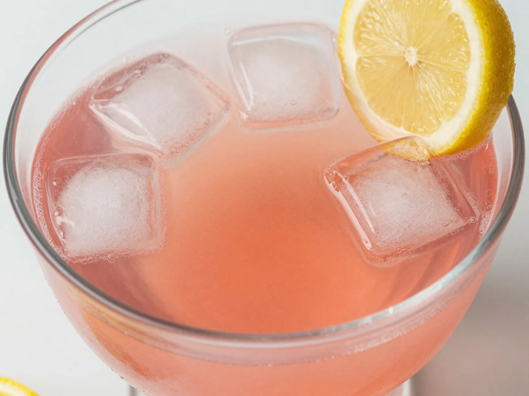 Non alcoholic pink punch with gradient effect in glass bowl