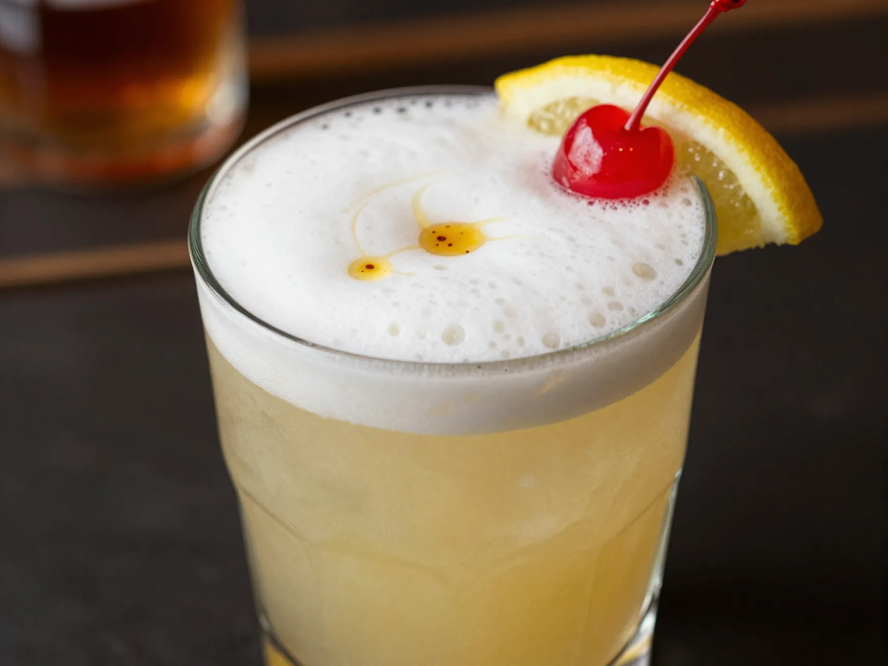 Whiskey sour with bourbon lemon and egg white foam