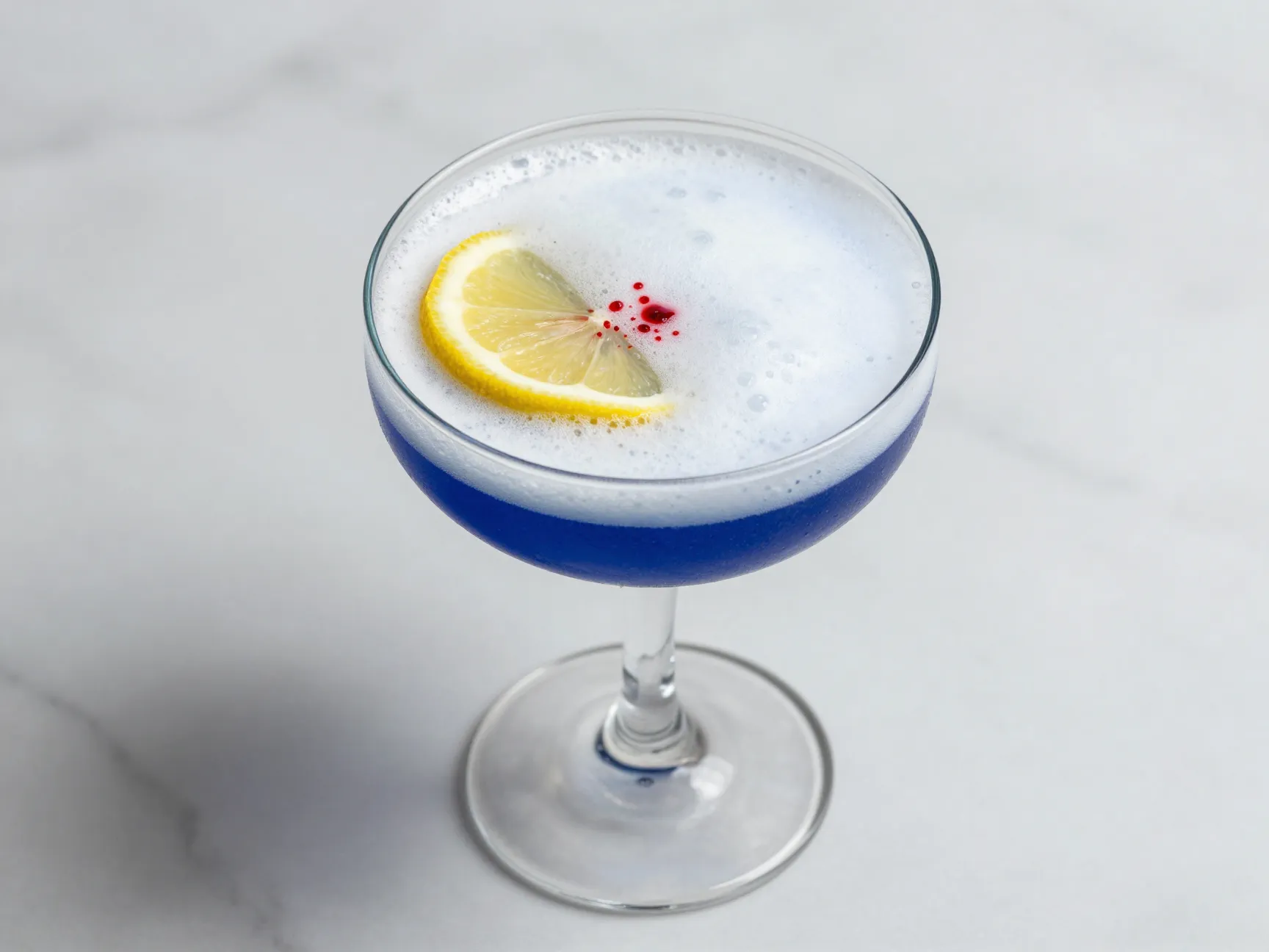 Indigo 00 sour foam lemon wheel bitters